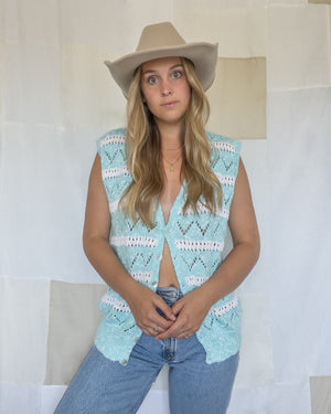 Vintage hand-knit blue and white sweater vest. Women's size medium. 